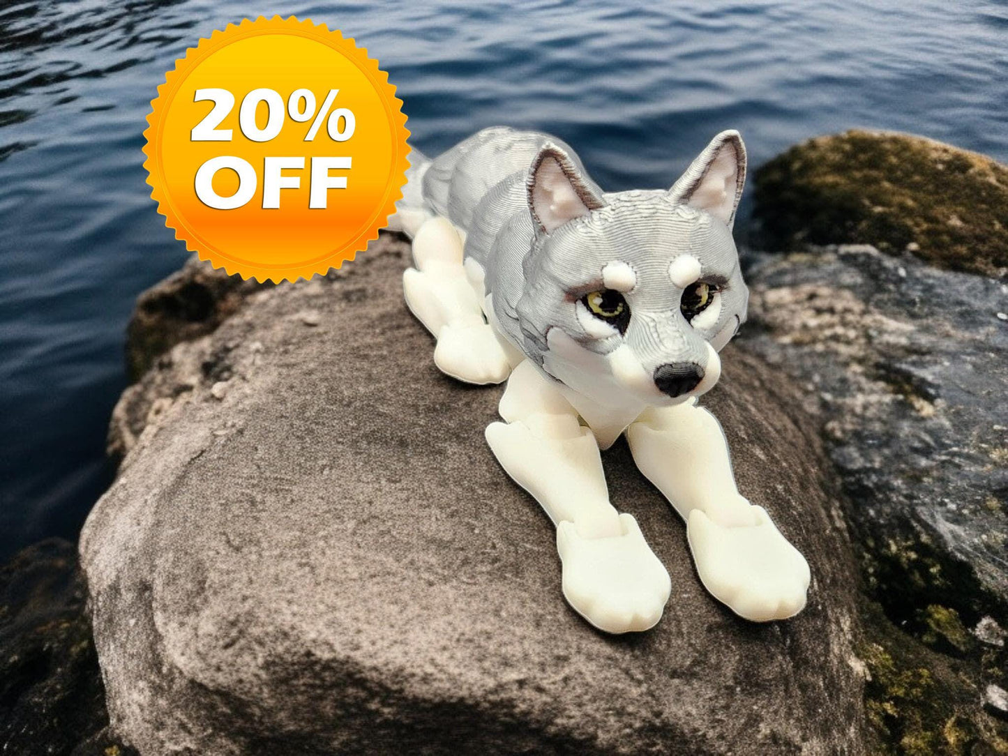 3D printed realistic wolf figurine lying on a rock near water with 20 percent off badge