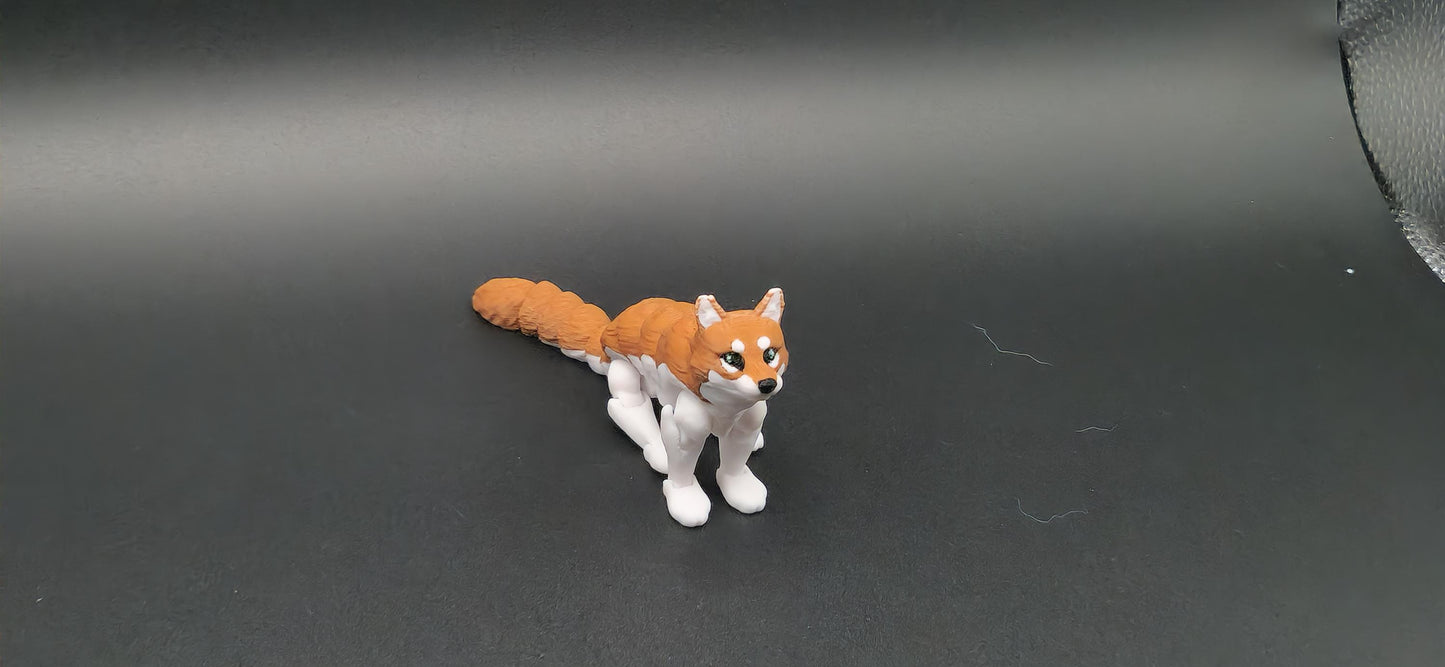 3D printed realistic wolf figurine in orange and white colors displayed on black background