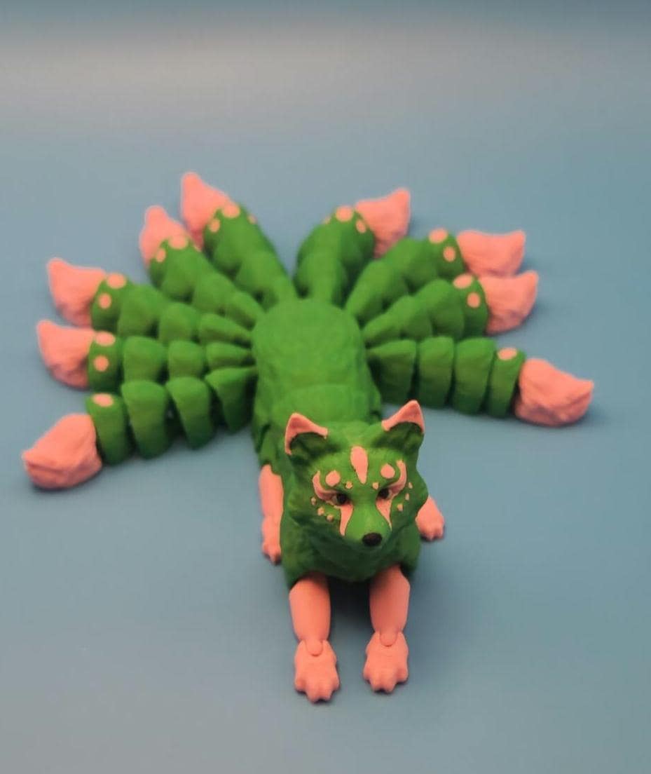 Green and pink Japanese kitsune figurine 9-tailed fox mythical creature with detailed tails and face