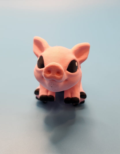Pink pig-shaped toy on a light blue background