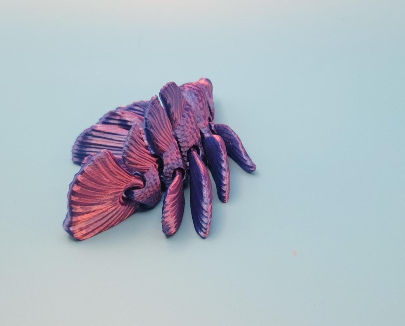3D printed betta fish toy in purple and pink hues with detailed fins and scales