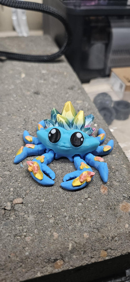 Colorful 3D printed crystal crab figurine in blue with crystal details on its back