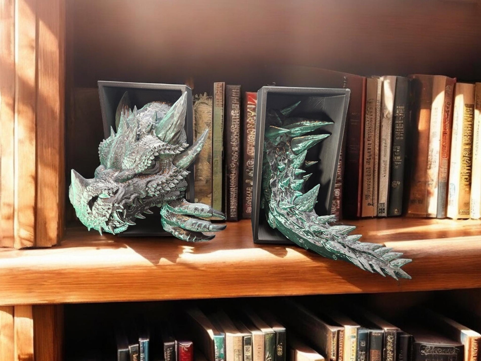 3D printed dragon bookend set in metallic green holding books on wooden shelf