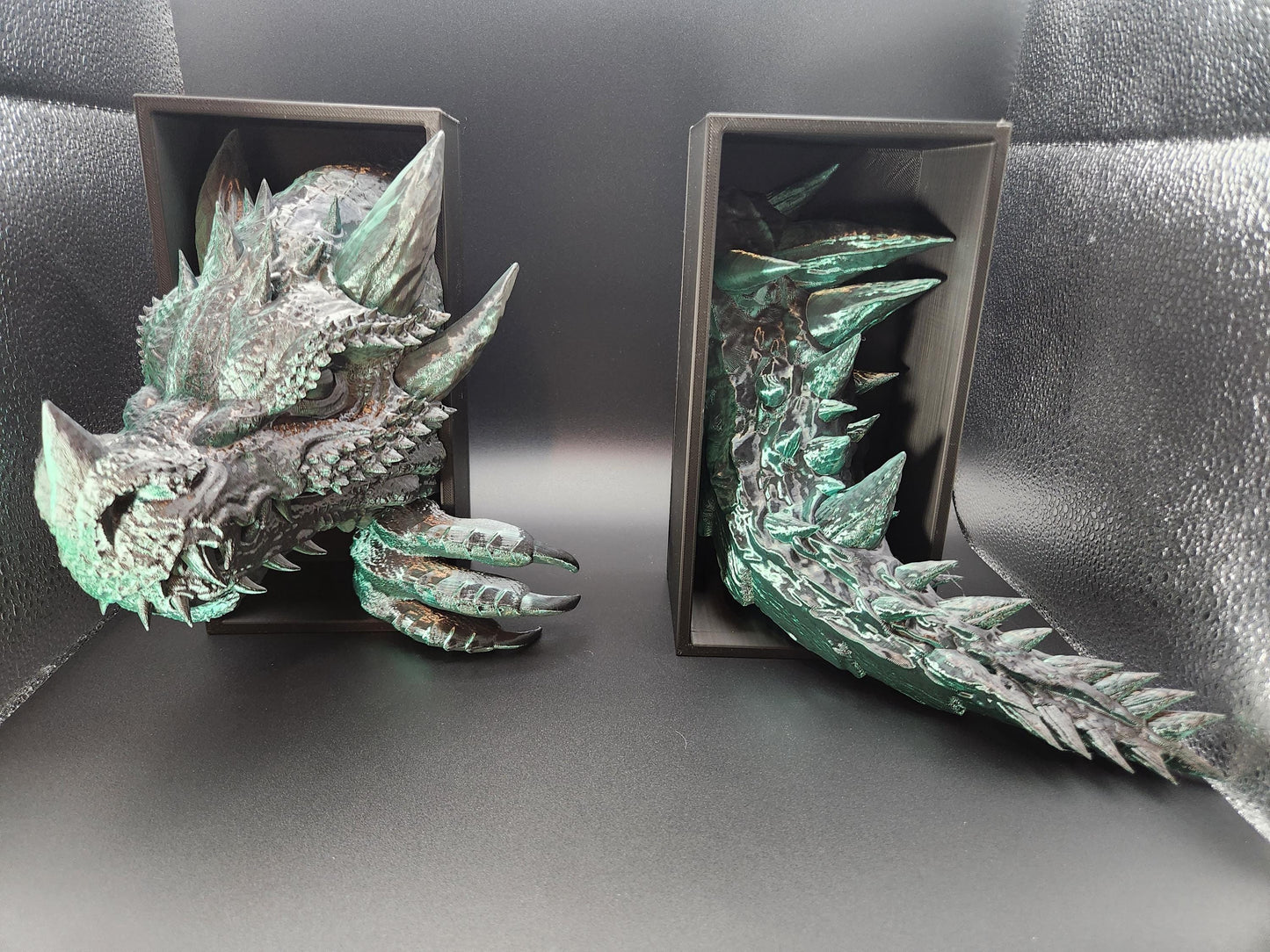 Etsy 3D printed dragon bookend with detailed textured scales and greenish patina finish holding books