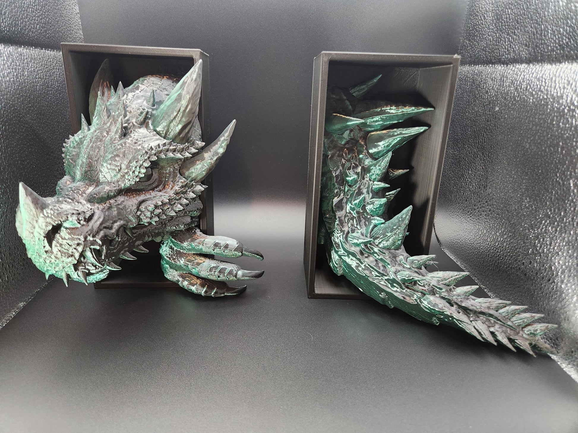 Etsy 3D printed dragon bookend with detailed textured scales and greenish patina finish holding books