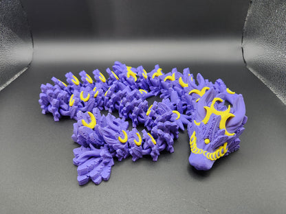 Etsy 3D printed lunar dragon figurine in purple and yellow with intricate details