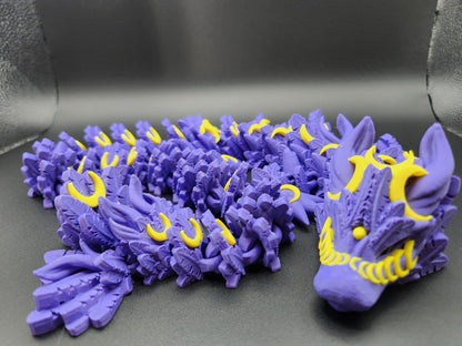 Purple and yellow 3D printed lunar dragon figurine with detailed scales and facial features