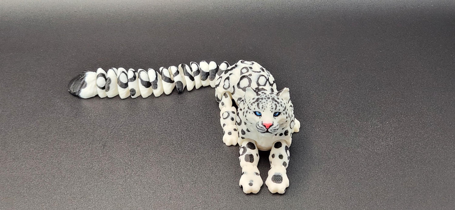 3D printed snow leopard figurine with intricate spotted design and detailed facial features