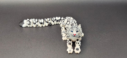 3D printed snow leopard figurine with intricate spotted design and detailed facial features