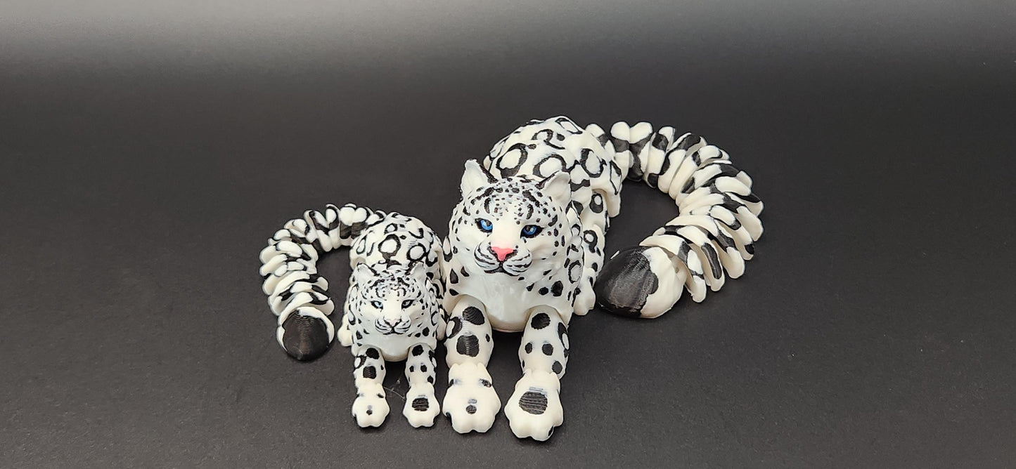 Etsy 3D printed snow leopard figurine set with detailed black and white spotted design on a black background