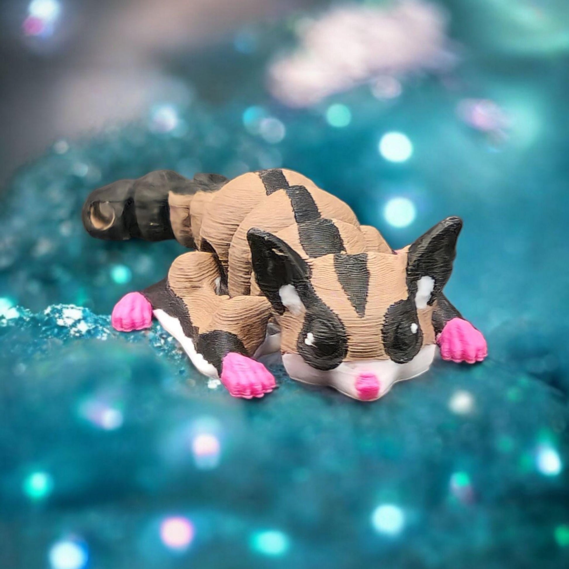 Cute 3D printed sugar glider keychain with pink paws and detailed black and tan markings