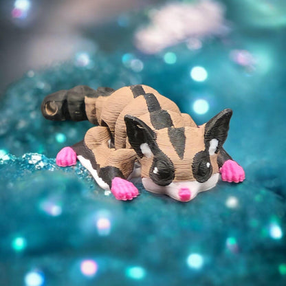 Cute 3D printed sugar glider keychain with pink paws and detailed black and tan markings