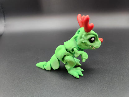 Green Christmas Santa T-Rex figurine with red antlers and nose on black background