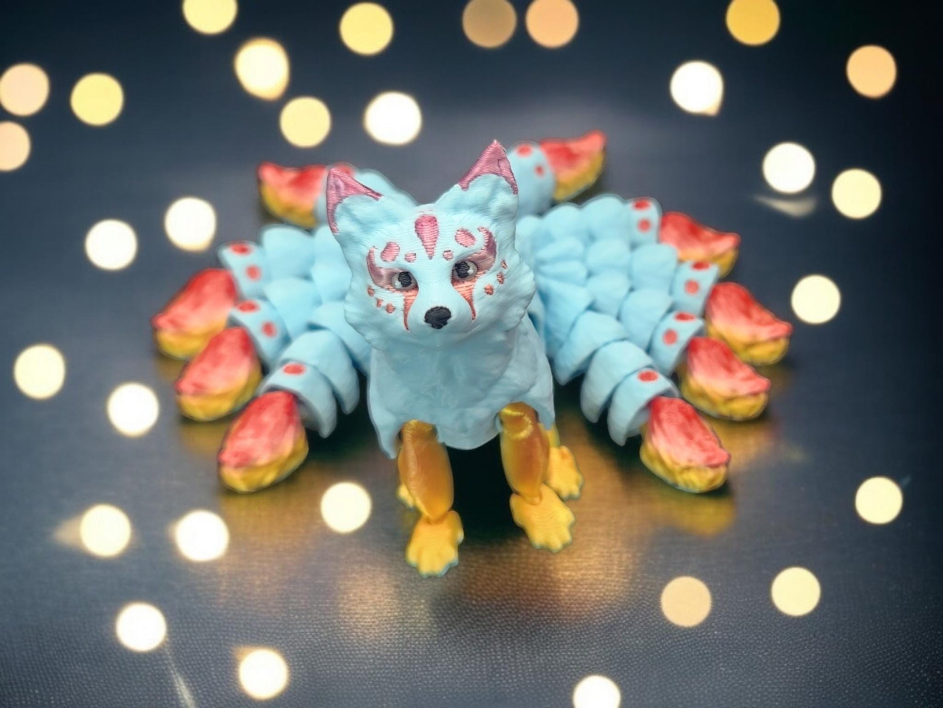 Handcrafted Japanese kitsune figurine 9-tailed fox mythical creature with blue body and red-tipped tails