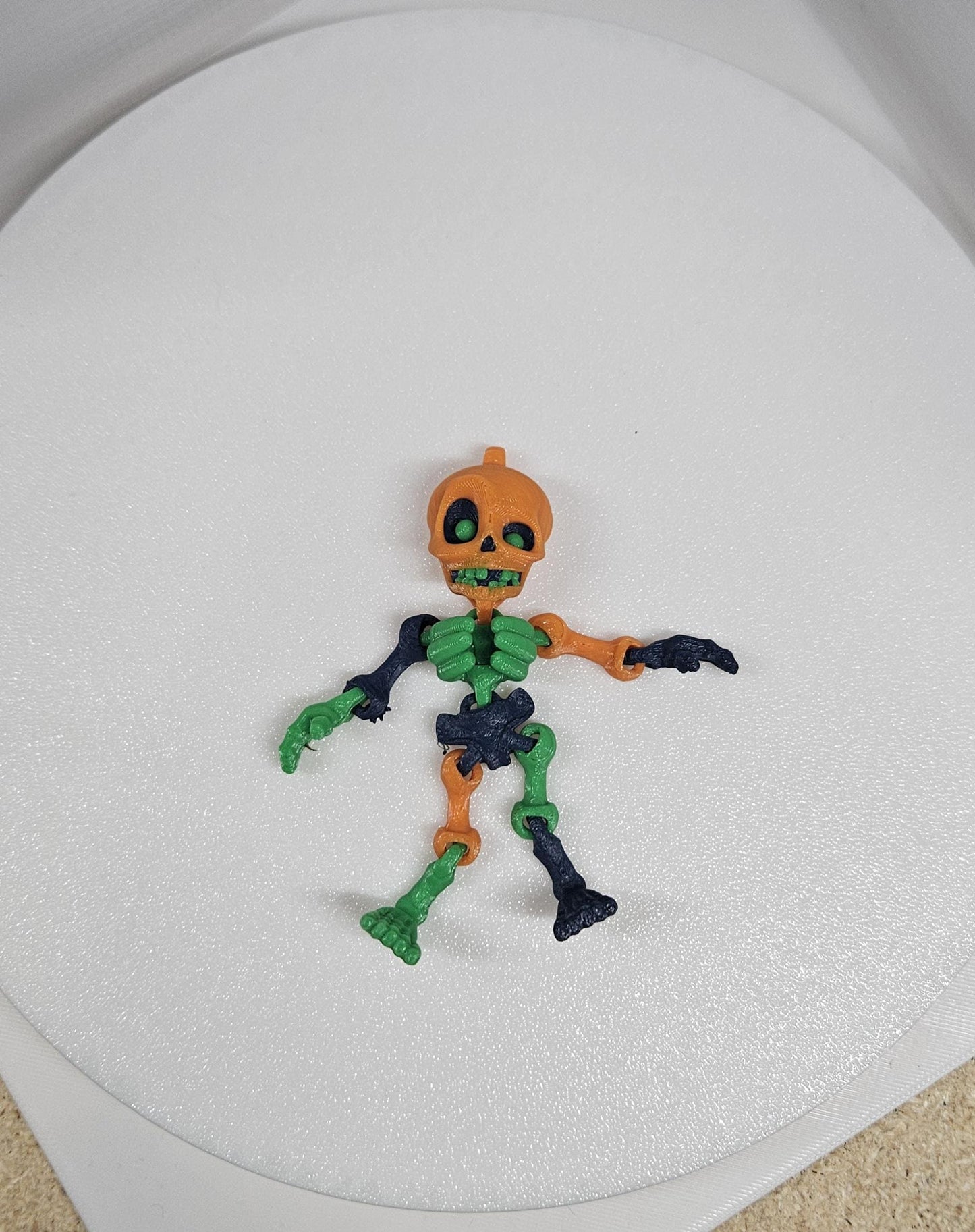 3D printed articulated flexy Halloween colored skeleton