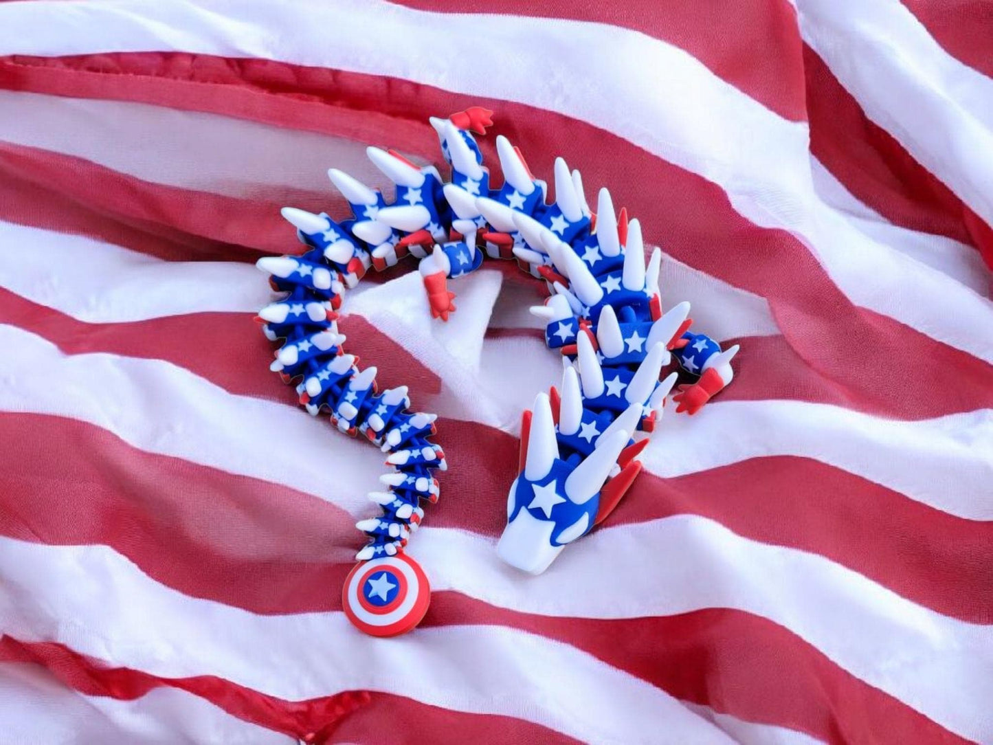 Legend inspired dragon action figures in red white and blue star pattern on an American flag backdrop