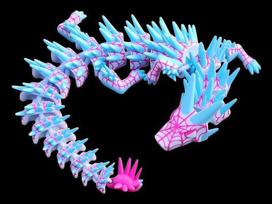 Legend inspired dragon action figures in blue and pink with intricate web design and spikes