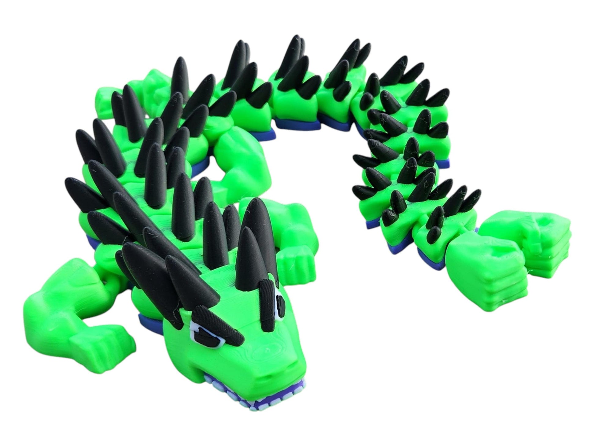 Legend inspired dragon action figures in green with black spikes and blue accents segmented for flexible posing