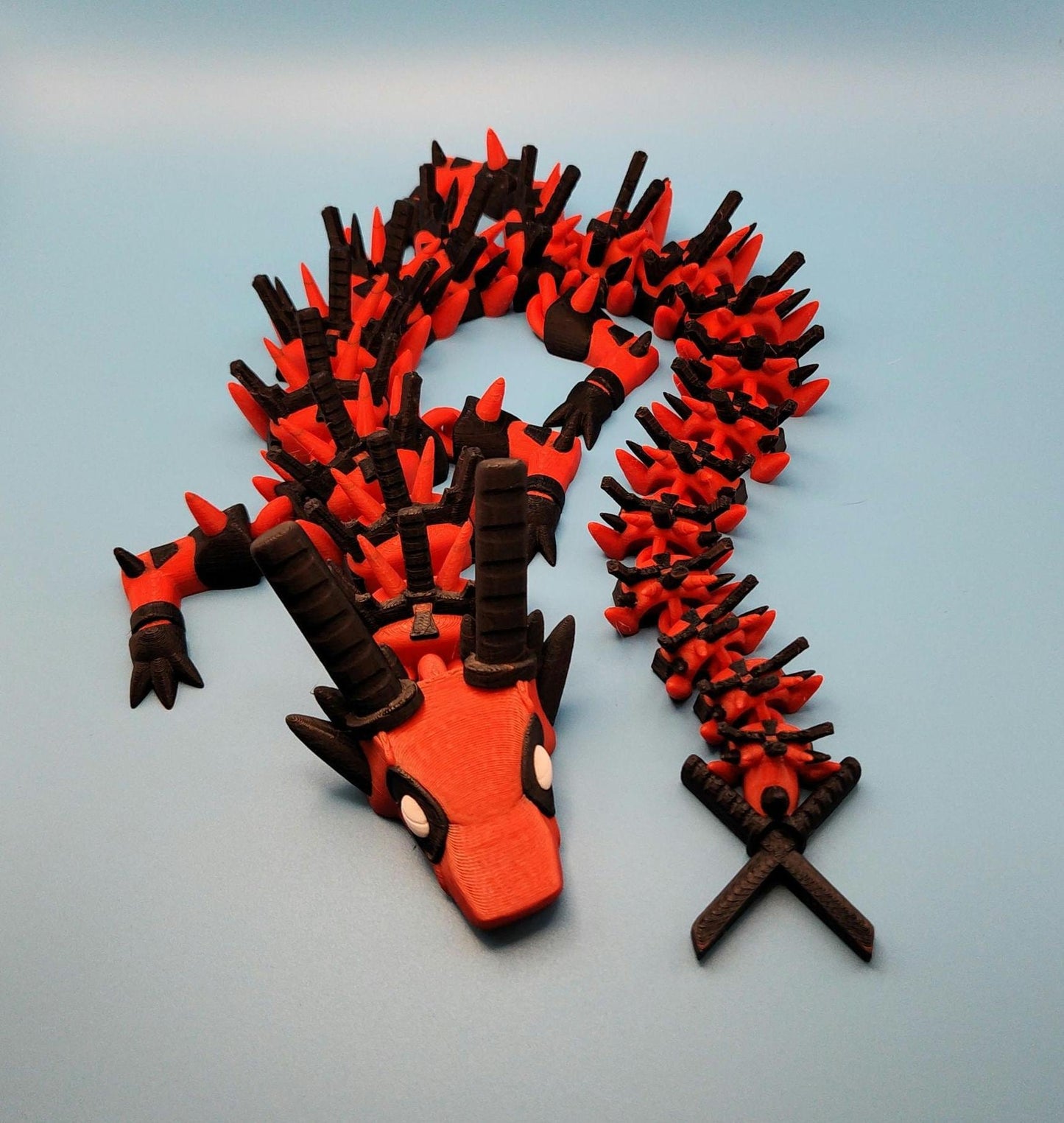 Legend inspired dragon action figures in red and black with detailed spikes and articulated body from Etsy