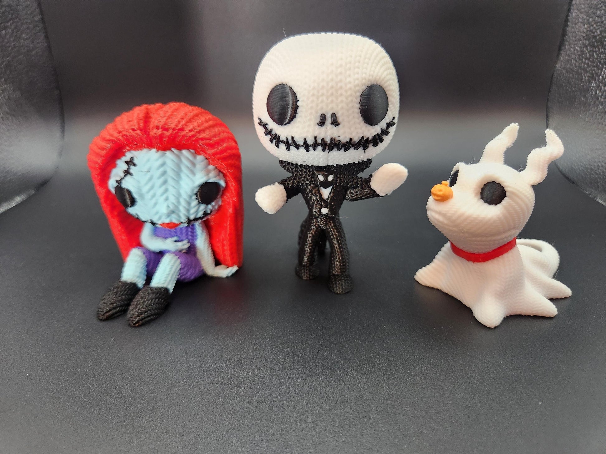 Unique crochet Nightmare Before Christmas gifts featuring handmade Jack Skellington Sally and Zero figurines