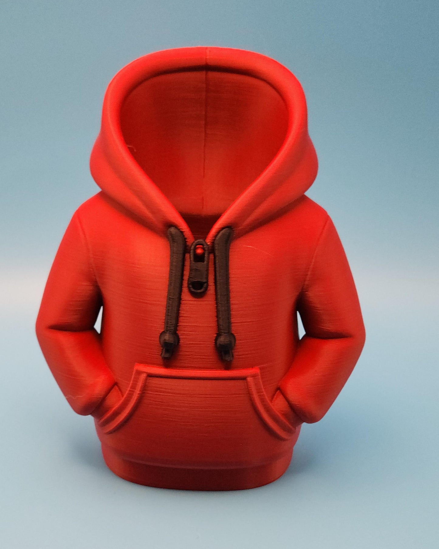 Red hoodie-shaped novelty pencil cup for office with detailed zipper and pocket design