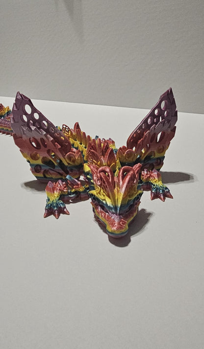 Colorful 3D printed winged crystal dragon figurine with intricate rainbow detailing and textured wings