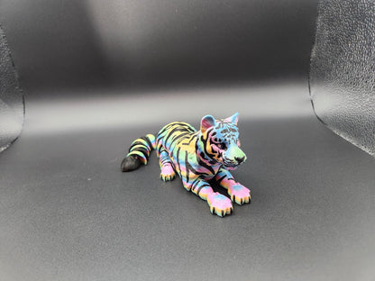 Colorful realistic tiger figurine 3D print lying down with vibrant striped details on black background