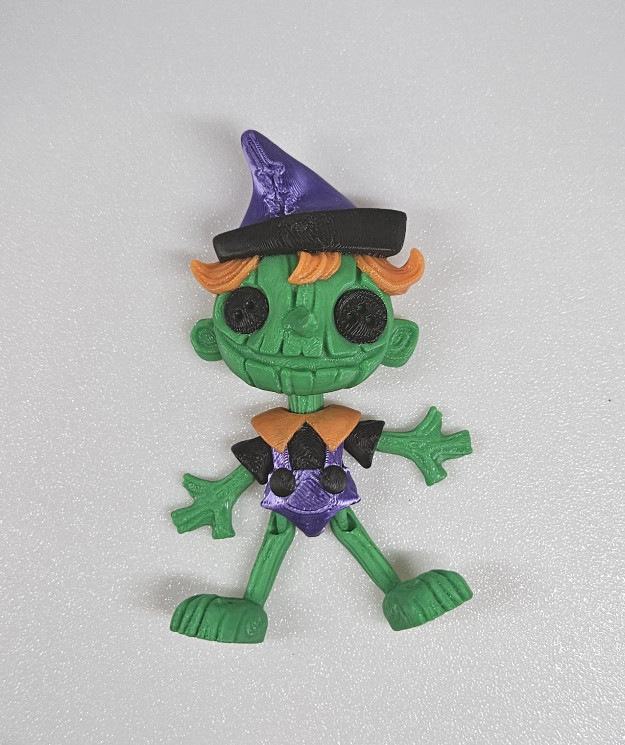 Spooky articulated dolls pinnocchio themed green witch doll with purple hat and orange hair