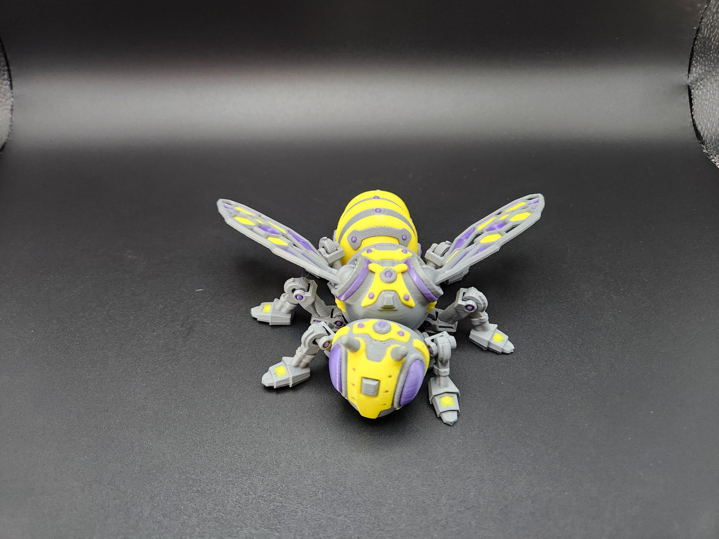 Steampunk mech bee collectible in yellow and gray with detailed mechanical wings and legs