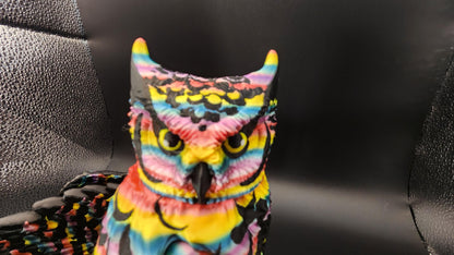 Colorful poseable articulated rainbow great horned owl figurine with vivid stripes and detailed features