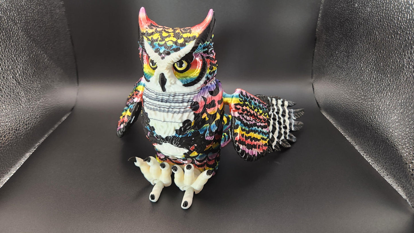 Colorful poseable articulated rainbow great horned owl figurine with detailed feathers
