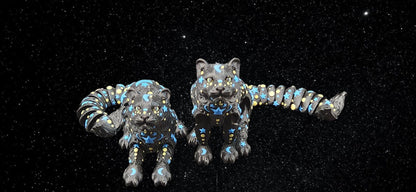 Black star and moon fidget panther figurines with celestial patterns on a starry background